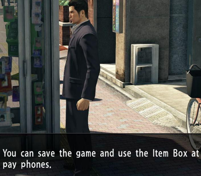 you can save the game and use item box at pay phones from Yakuza 0 UI screenshot (English)